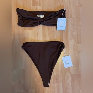 NWT AEXAE ruched bandeau top in brown and triangle high cut bottoms in brown.